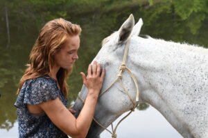 Production Still of Actress Shannon Spangler and the horse, Zack on set